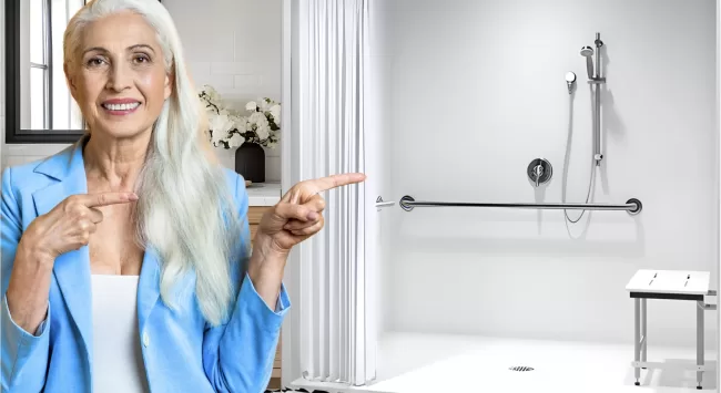 Representative pointing to ADA roll-in showers for university and commercial facilities